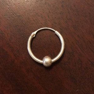 One sterling silver hoop earring with ball
